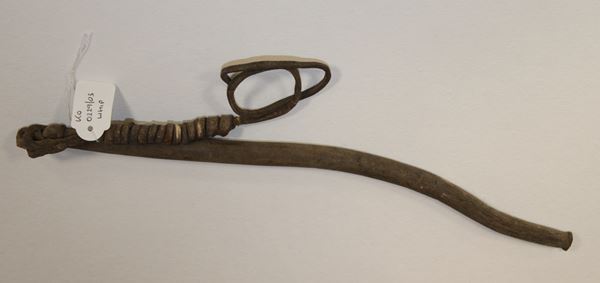 photo of a short, thick leather whip with a thinner leather loop at one end.
